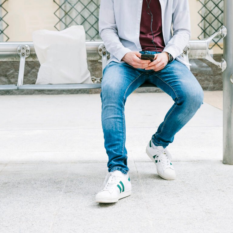 low-section-man-using-smartphone